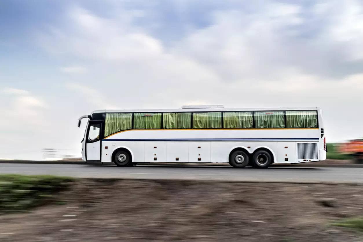 Full-size coach bus in motion on a highway